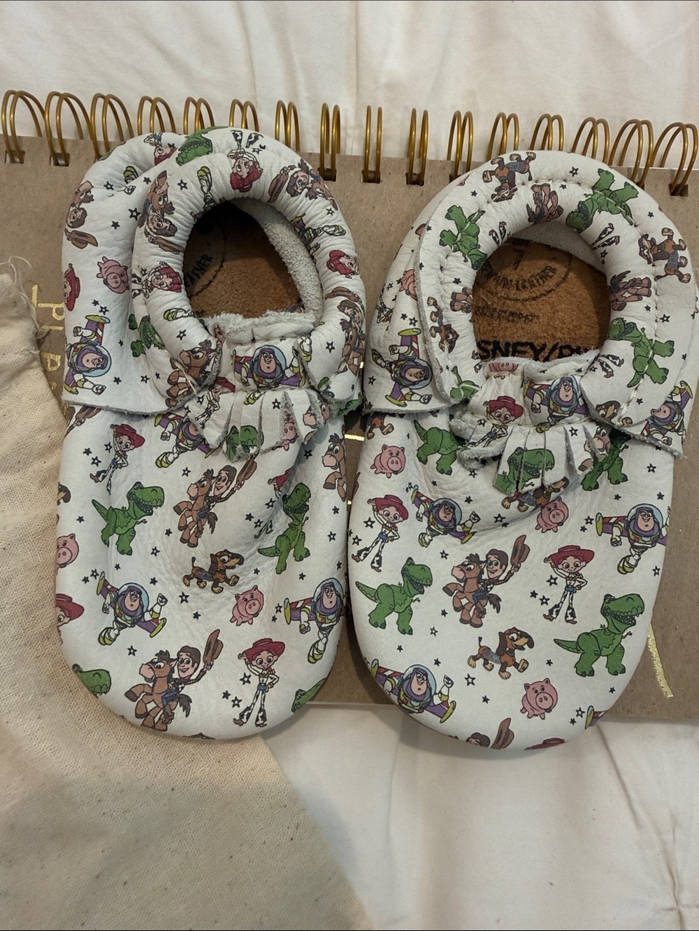 Disney Baby Moccasins in White with Multicolor Toy Story Print